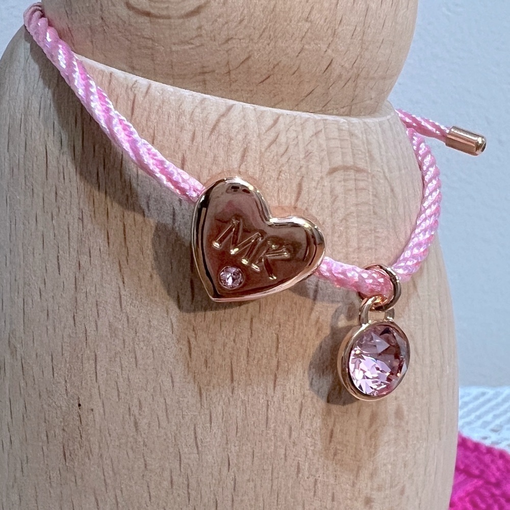 NWOT Mary Kay bracelet with pink cord and Swarovski elements charms